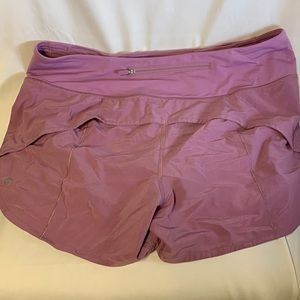 Lululemon shorts.  Not sure on style but certain they are at least 4”.
